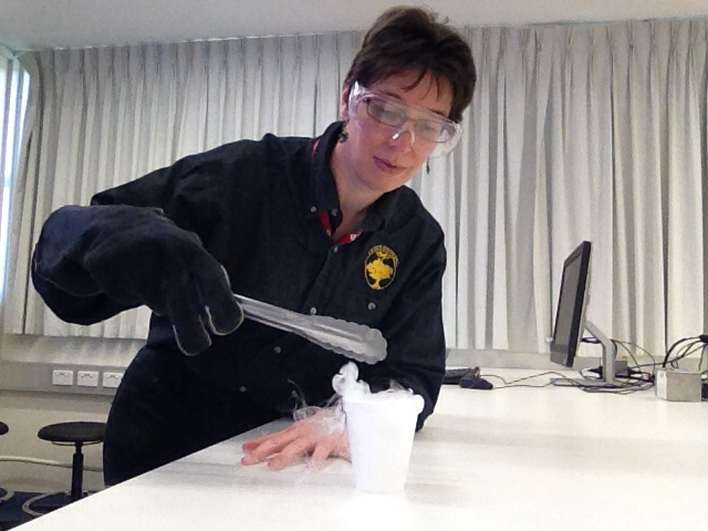 Elaine Walker: This is me between labs in my denim Liaden Universe shirt investigating the sublimation of dry ice. 